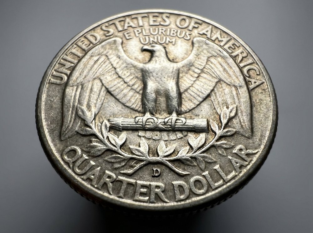 Close-up of Washington quarter reverse mint mark location below the wreath